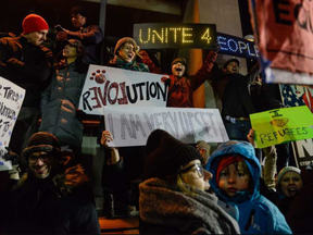 Protestors rally during a demonstration against the Muslim immigration ban at John F. Kennedy International Airport. (Stephanie Keith, Getty Images)