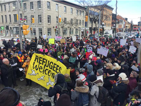 Several thousand people rallied at the U.S. Embassy in Ottawa on Monday to protest the U.S. immigration crackdown by the administration of President Donald Trump. (Wayne Cuddington, Postmedia)