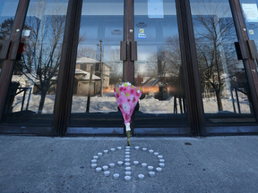 Flowers and candles were left at the Ottawa Mosque on Northwestern Ave in Ottawa Monday January 30, 2017. (Tony Caldwell, Postmedia)
