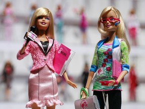 In this Feb. 14, 2010 file photo, news anchor Barbie, left, and computer engineer Barbie are arranged for a photo at the New York Toy Fair. A new study published Thursday, Jan. 26, 2017, in the journal Science suggests that girls as young as 6 can be led to believe that men are inherently smarter and more talented than women, making them less motivated to pursue novel activities and ambitious careers. That such stereotypes exist is hardly a surprise, but the findings show that the biases can affect children at a very young age. (AP Photo/Mark Lennihan, File)