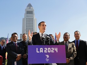 Los Angeles Mayor Eric Garcetti (centre) speaks during a news conference Wednesday, Jan. 25, 2017. The Los Angeles City Council has given its final approval to a proposal that could bring the 2024 Olympic Games to Southern California. (Jae C. Hong/AP Photo)