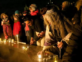 About 1,500 people came out to a Monday night Parliament Hill candlelight vigil for the victims of the Quebec mosque attack. JULIE OLIVER / POSTMEDIA