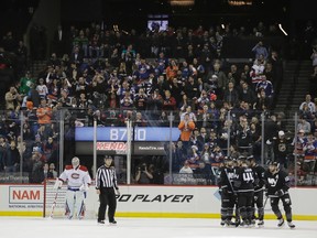 Canadiens goalie Carey Price (left) reacts as the Islanders celebrate a goal during first period NHL action in Brooklym, N.Y., on Thursday, Jan. 26, 2017. (Frank Franklin II/AP Photo)