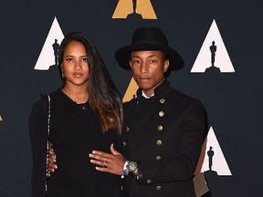Pharrell Williams and Helen Lasichanh attend the 8th Annual Governors Awards hosted by the Academy of Motion Picture Arts and Sciences on November 12, 2016, at the Hollywood & Highland Center in Hollywood, California. The Academy's Board of Governors is presenting Honorary Oscar Awards to actor Jackie Chan, film editor Anne Coates, casting director Lynn Stalmaster and documentary filmaker Frederick Wiseman.(VALERIE MACON/AFP/Getty Images)