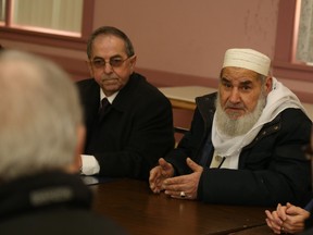 Jason Miller/The Intelligencer
Coun. Garnet Thompson (first left), chairperson of the city's inclusivity committee, paid a visit to the Islamic Society of Belleville where he expressed sadness about the Quebec City shooting and informed Mohammad Saleh, Imam of the mosque, of plans to stage a vigil and march this Thursday. Saleh thanked the group for standing in solidarity with local Muslims.