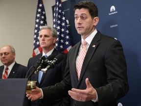 House Speaker Paul Ryan of Wis., joined by House Majority Leader Kevin McCarthy of Calif., centre, and House Majority Whip Steve Scalise of La., meets with reporters on Capitol Hill in Washington, Tuesday, Jan. 31, 2017, following GOP strategy session. Ryan gave a strong defense of President Donald Trump's refugee and immigration ban to caucus members and said he backs the executive order, which has created chaos and confusion worldwide. (AP Photo/J. Scott Applewhite)