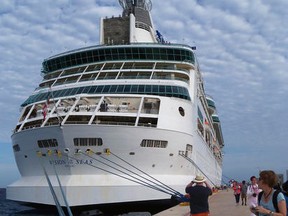 In this Feb. 11, 2016 photo provided by Joe Kafka, Gina Kafka, far right, of Valley Springs, S.D, glances back at the Vision of the Seas cruise ship shortly after it docks in Cozumel, Mexico. As snowbirds, Kafka and her husband, Joe, picked Florida for their winter stay because of easy access to its many cruise ports. (Joe Kafka via AP)