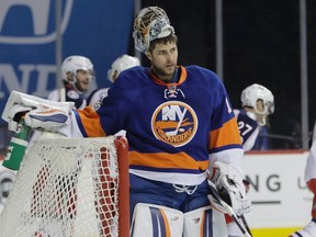 New York Islanders goalie Thomas Greiss reacts after Columbus Blue Jackets' Nick Foligno scored a goal during an NHL game on Jan. 24, 2017, in New York. (THE CANADIAN PRESS/Frank Franklin)