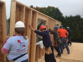 Applicants for a Habitat for Humanity home work with qualified trades people who donate their time to help the family meet their 500 hours of “sweat equity” as part of their home-ownership arrangement. (HABITAT FOR HUMANITY/Supplied Photo)