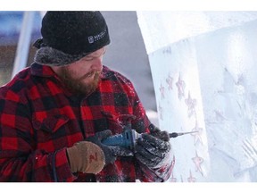 Nathan McKeough carves an ice sculpture on the Ottawa City Hall grounds in preparation for Winterlude, January 31, 2017. JEAN LEVAC / POSTMEDIA NEWS