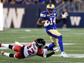 Winnipeg Blue Bombers KR Quincy McDuffie eludes a tackle from Calgary Stampeders DB Osagie Odiase during CFL action in Winnipeg on Thu., July 21, 2016. McDuffie will face his former team when the Bombers visit Ottawa. (Kevin King/Winnipeg Sun/Postmedia Network file)
