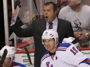 New York Rangers' Alain Vigneault reacts to a call during an NHL game against the Vancouver Canucks at Rogers Arena in Vancouver on Sept. 26, 2013. (Carmine Marinelli/Postmedia)