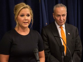 Comedian Amy Schumer (L) and U.S. Senator Chuck Schumer (D-NY) speak at a press conference calling for tighter gun laws in an effort to stop mass shootings and gun violence on August 3, 2015 in New York City. (Andrew Burton/Getty Images)