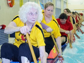 From left, Gwen Frankland and Collette Johanson practice dragon boat paddling techniques in the pool at the Oil Heritage District Community Centre on Monday, Jan. 31, 2017 in Petrolia, Ont. The pair are on a team called the Ice Pix that will be competing at the inaugural Ottawa Ice Dragon Boat Festival Feb. 17-18. (Terry Bridge/Sarnia Observer/Postmedia Network)