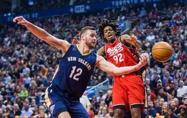 Toronto Raptors Lucas Nogueira during 1st half action against New Orleans Pelicans Donatas Motiejunas at the Air Canada Centre in Toronto, Ont. on Tuesday January 31, 2017. Ernest Doroszuk/Toronto Sun/Postmedia Network