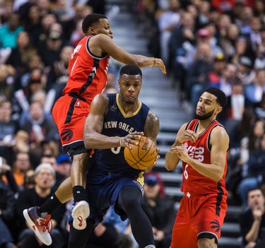 Toronto Raptors Kyle Lowry (left) and Cory Joseph during 2nd half action against the New Orleans Pelicans Terrence Jones at the Air Canada Centre in Toronto, Ont. on Tuesday January 31, 2017. Ernest Doroszuk/Toronto Sun/Postmedia Network