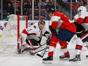 Senators goaltender Mike Condon stops a shot by Panthers forward Shawn Thornton during first period NHL action in Sunrise, Fla., on Tuesday, Jan. 31, 2017. (Joel Auerbach/Getty Images)