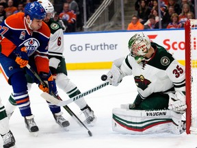 Minnesota Wild goalie Darcy Kuemper makes a save with Edmonton Oilers forward Milan Lucic in close at Rogers Place on Tuesday Jan. 31, 2017. (David Bloom)