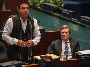 Councillor Giorgio Mammoliti and Mayor John Tory are pictured at a city council meeting.(CRAIG ROBERTSON/Toronto Sun)