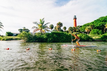Blueline Surf and Paddle - Cruising on a stand-up paddleboard is a great way to enjoy nature - and burn some calories - in Jupiter, Florida. PHOTO COURTESY PALM BEACHES TOURISM AND GREG PANAS