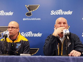 Mike Yeo, left, the St. Louis Blues' new coach, and general manager Doug Armstrong meet with the press after the Blues announced they are replacing Ken Hitchcock with Yeo during an NHL hockey news conference, Wednesday, Feb. 1, 2017, in St. Louis. (David Carson/St. Louis Post-Dispatch via AP)