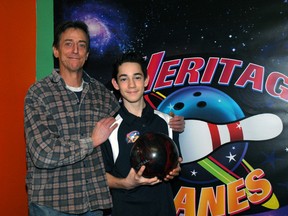 Coach Fred Phillips, left, with his protege Gordon Vlasic, 14, at Heritage Lanes in St. Thomas. The teen is on cloud nine after bowling a perfect game in December. (Ian McCallum/Times-Journal)