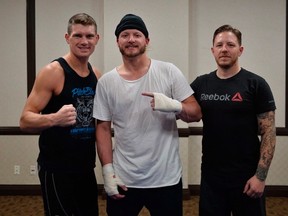 MMA fighter Stephen Thompson (left to right), Toronto Blue Jays slugger Josh Donaldson, and training coach Brandon Gibson are shown in a handout photo. (THE CANADIAN PRESS/HO-UFC-Brandon Magnus)