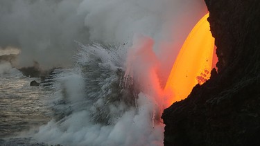 This image obtained Jan. 31, 2017 from the U.S. Geological Survey's Hawaiian Volcano Observatory showing a  lava stream, pouring out of the lava tube on the sea cliff at the Kamokuna ocean entry from the Kilauea Volcano on Jan. 29. (USGS /HO/AFP/Getty Images)