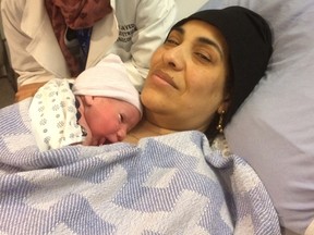 Ibtesam Alkarnake poses with baby Eyad after giving birth at the Northern Lights Regional Health Centre on Wednesday, February 1, 2017. The Alkarnake family had arrived in Canada the night before from a refugee camp in Jordan. Supplied Image/Fort City Church