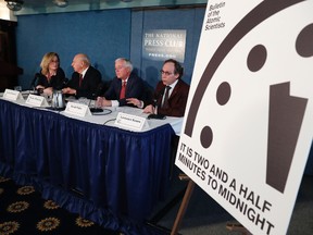 From left, Rachel Bronson, executive director and Publisher of the Bulletin of the Atomic Scientists; Thomas Pickering, co-chair of the International Crisis Group; David Titley, a nationally known expert in the field of climate, the Arctic, and national security; and Lawrence Krauss, theoretical physicist, chair of the Bulletin of the Atomic Scientists Board of Sponsors, participate in a news conference the at the National Press Club in Washington, Thursday, Jan. 26, 2017, announcing that the Bulletin of the Atomic Scientist have moved the minute hand of the Doomsday Clock to two and a half minutes to midnight. (AP Photo/Carolyn Kaster)