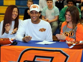 Sherwood Park football star Chuba Hubbard signs with Oklahoma State University at his high school at Bev Facey on February 1, 2017.