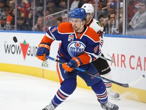 Kris Russell #4 of the Edmonton Oilers defends against Patrick Kane #88 of the Chicago Blackhawks on November 21, 2016 at Rogers Place in Edmonton.