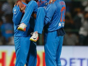 India spinner Yuzvendra Chahal is hoisted by teammates as they celebrate taking a ticket during yesterday’s demolition of England. The little-known Chahal had six wickets in the match. (AP)