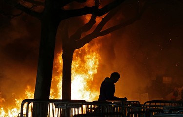 A bonfire set by demonstrators protesting a scheduled speaking appearance by Breitbart News editor Milo Yiannopoulos burns on Sproul Plaza on the University of California at Berkeley campus on Wednesday, Feb. 1, 2017, in Berkeley, Calif. The event was canceled out of safety concerns after protesters hurled smoke bombs, broke windows and started a bonfire. (AP Photo/Ben Margot)