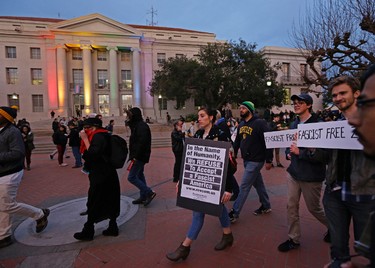 People march in front of Sproul Hall to protest the appearance of Breitbart News editor Milo Yiannopoulos on Wednesday, Feb. 1, 2017, in Berkeley, Calif. The University of California at Berkeley is bracing for major protests Wednesday against Milo Yiannopoulos, a polarizing Breitbart News editor, on the last stop of a tour aimed at defying what he calls an epidemic of political correctness on college campuses. (AP Photo/Ben Margot)