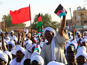 Supporters of Sudanese opposition leader and ex-prime minister Sadiq al-Mahdi, whose civilian government was overthrown in a 1989 coup that brought President Omar al-Bashir to power, celebrate during a gathering in Omdurman on January 26, 2017 upon his return to the country. /  ASHRAF SHAZLYASHRAF SHAZLY/Getty Images