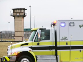 More ambulances arrive on scene as all Delaware prisons went on lockdown Wednesday, Feb. 1, 2017, due to a hostage situation unfolding at the James T. Vaughn Correctional Center in Smyrna. (Suchat Pederson/The Wilmington News-Journal via AP)