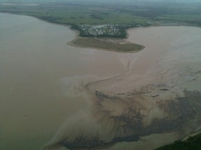 The Red Deer River is seen in an aerial photo taken after a pipeline carrying crude started spilling oil into a tributary creek near Sundre, Alberta on June 8, 2012. (Photo courtesy of Global Calgary)