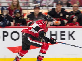 Ottawa Senators right winger Curtis Lazar gets sprayed with a water bottle by Chris Neil as he passes the bench while competing in the fastest skater event of the Sens Skills Competition at the Canadian Tire Centre on Dec. 30, 2016. (Errol McGihon/Postmedia)