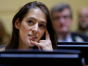 In this Jan. 3, 2017 file photo, Rhode Island state Rep. Moira Walsh, D-Providence, listens during swearing-in ceremonies in the House Chamber at the Statehouse in Providence, R.I.  (AP Photo/Steven Senne, File)