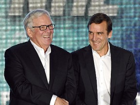 Majority owner Bill Foley and general manager George McPhee talk before the Vegas Golden Knights was announced as the name for Foley's Las Vegas NHL franchise at T-Mobile Arena on Nov. 22, 2016. (Ethan Miller/Getty Images)