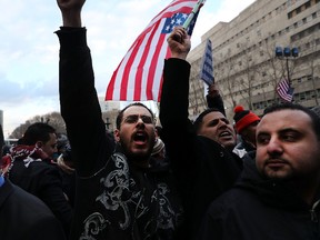 Ethinic Yemenis and supporters protest against President Donald Trump's executive order temporarily banning immigrants and refugees from seven Muslim-majority countries, including Yemen on February 2, 2017 in the Brooklyn borough of New York City. At least 1,000 Yemeni-owned bodegas and grocery-stores across the city shut down from noon to 8 p.m. today to protest the order. (Photo by Spencer Platt/Getty Images)