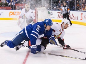 Toronto Maple Leafs left winger Matt Martin vies for the puck with Ottawa Senators defenceman Marc Methot during an NHL game in Toronto on Jan. 21, 2017. (THE CANADIAN PRESS/Chris Young)