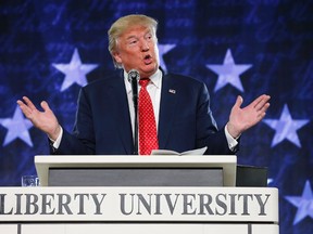 In this Jan. 18, 2016, file photo, Donald Trump gestures during a speech at Liberty University in Lynchburg, Va. Moving on a campaign promise, President Donald Trump said Thursday he will work for the repeal of the Johnson Amendment to free religious organizations from constraints on political activity (AP Photo/Steve Helber, File)
