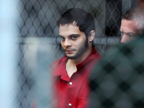 In this Jan. 9, 2017, file photo, Esteban Santiago is taken from the Broward County main jail as he is transported to the federal courthouse in Fort Lauderdale, Fla. (Amy Beth Bennett/South Florida Sun-Sentinel via AP, File)
