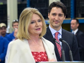 Prime Minister Justin Trudeau listens to London West MP Kate Young during his visit to the school's Centre for Applied Transportation Technologies. (DEREK RUTTAN, The London Free Press)