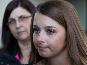 Crash victim Tayler Uganecz (right) speaks with the support of her mother Cheryl Uganecz about the sentencing of Michael Gress, 37, for manslaughter outside Court of Queen's Bench in Edmonton on Thursday, February 2, 2017. Ian Kucerak/Postmedia