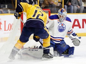 Edmonton Oilers goalie Cam Talbot blocks a shot by Nashville Predators center Mike Fisher (12) during the second period of an NHL hockey game Thursday, Feb. 2, 2017, in Nashville, Tenn.