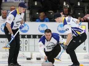 Skip Wayne Tuck Jr. had to contend with some tough ice in his win against Cory Heggestad in Cobourg, Ont., Thursday. (Pete Fisher/Postmedia Network)