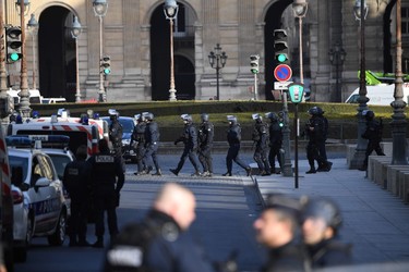 Policemen patrol near the Louvre museum on February 3, 2017 in Paris, after a soldier patrolling at the museum shot and seriously injured a machete-wielding man who yelled "Allahu Akbar" ("God is greatest") as he attacked security forces, police said. One soldier was "lightly injured" and has been taken to hospital, while the knifeman is in a serious condition but is still alive, security forces said. / AFP PHOTO / Eric FEFERBERGERIC FEFERBERG/AFP/Getty Images